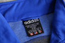 90s "adidas" blue × black geometric panel three stripe track jacket