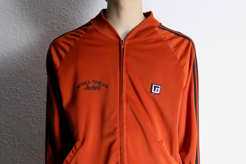 orange color track jacket set up