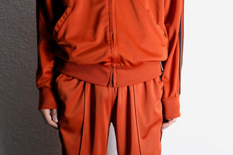 orange color track jacket set up