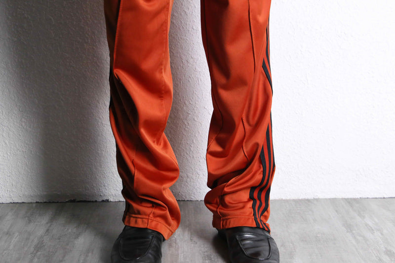 orange color track jacket set up