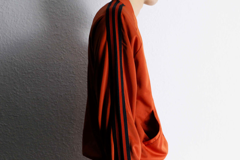 orange color track jacket set up