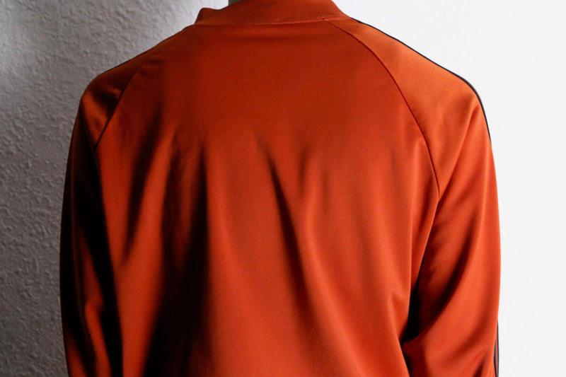 orange color track jacket set up