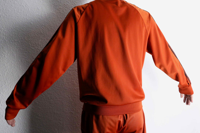 orange color track jacket set up