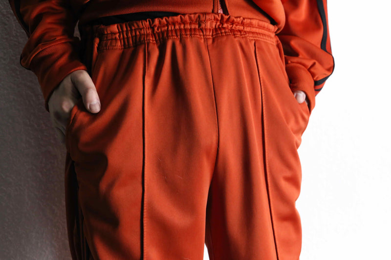 orange color track jacket set up