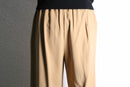 beige wide tuck slacks