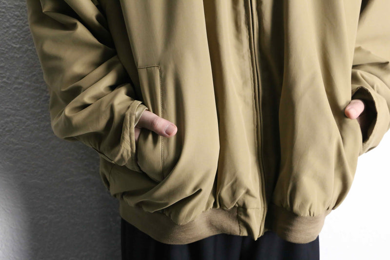 beige polyester chin strap drizzler jacket