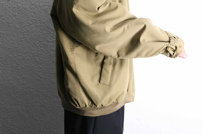 beige polyester chin strap drizzler jacket