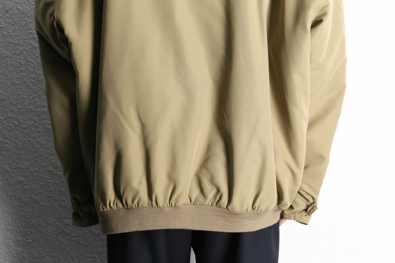 beige polyester chin strap drizzler jacket
