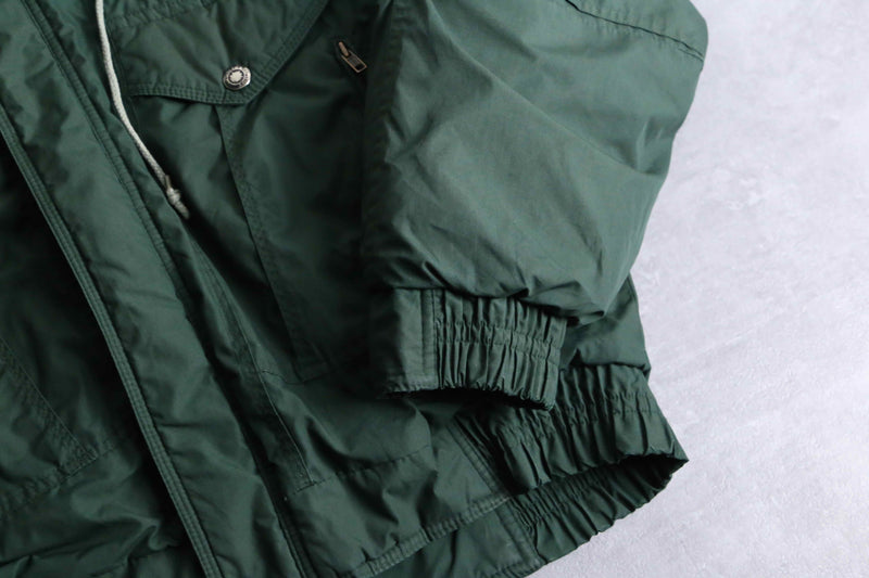 green color short length hi neck down jacket