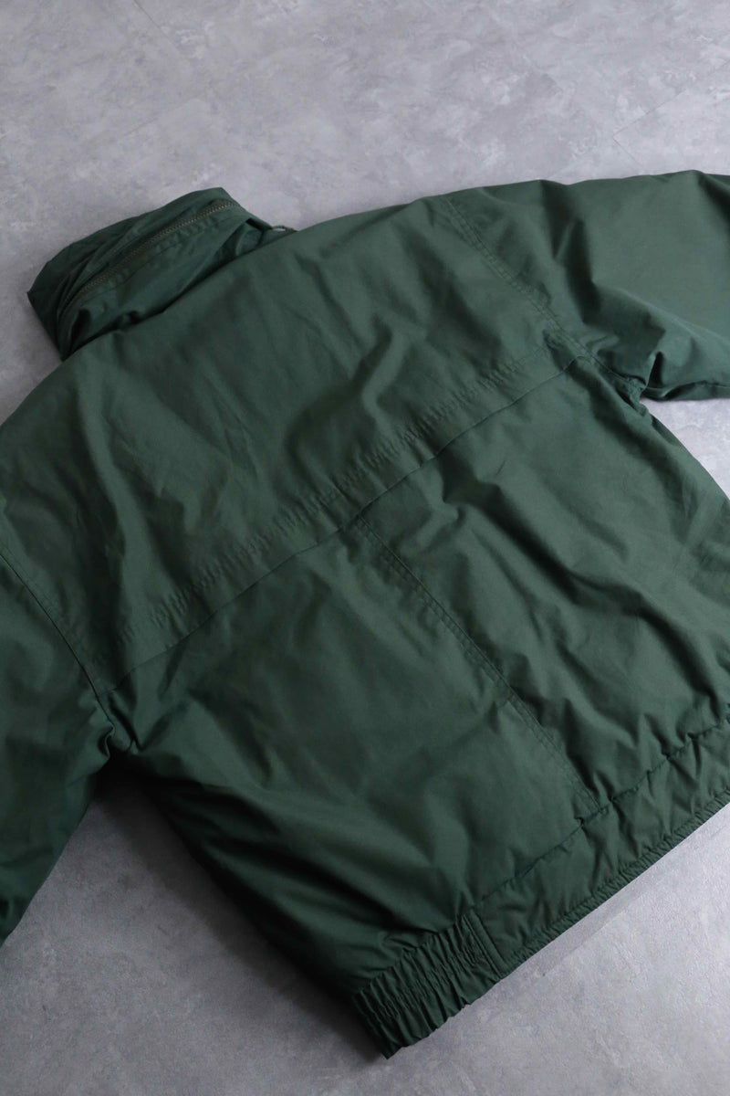 green color short length hi neck down jacket