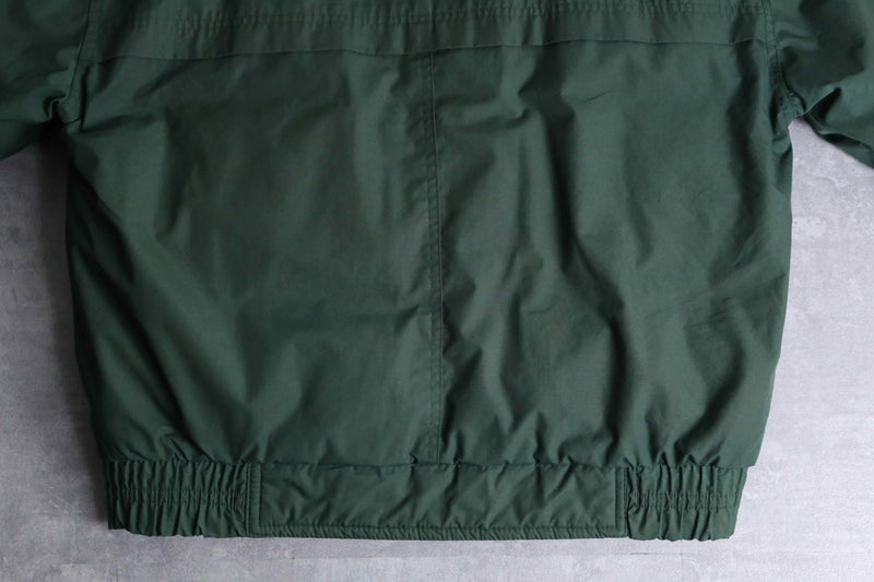 green color short length hi neck down jacket