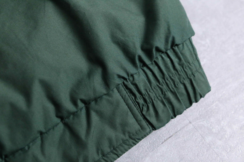 green color short length hi neck down jacket