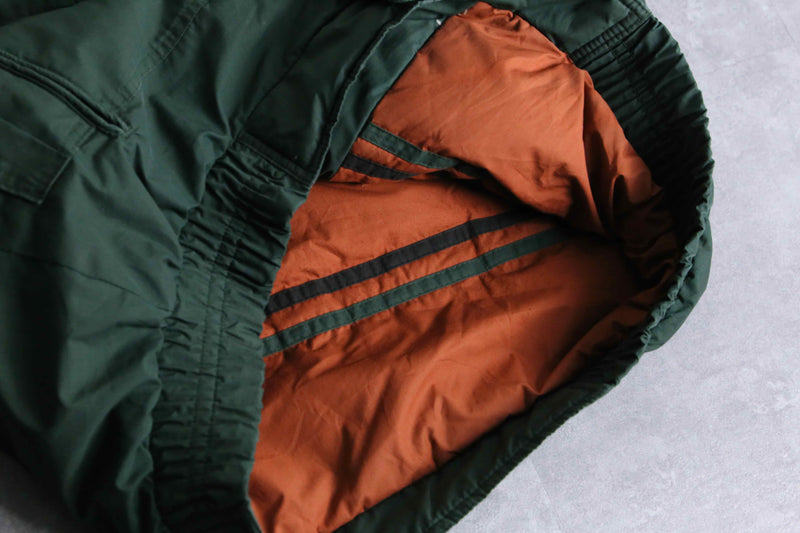 green color short length hi neck down jacket