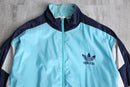 “adidas” pale blue nylon track jacket