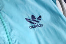 “adidas” pale blue nylon track jacket