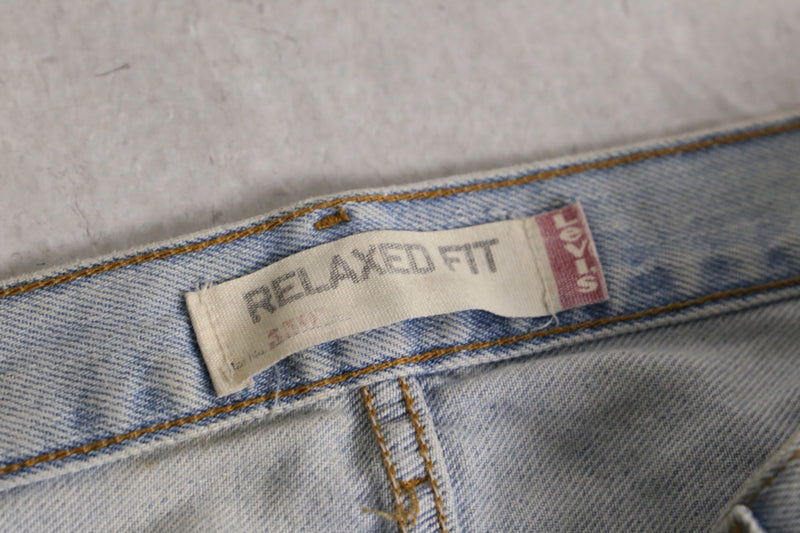 “Levi’s 550” fade indigo wide tapered denim pants