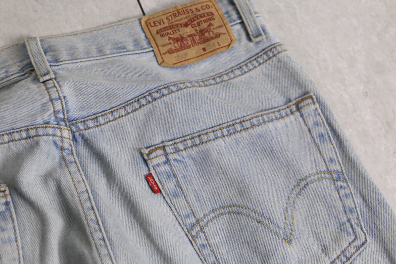 “Levi’s 550” fade indigo wide tapered denim pants