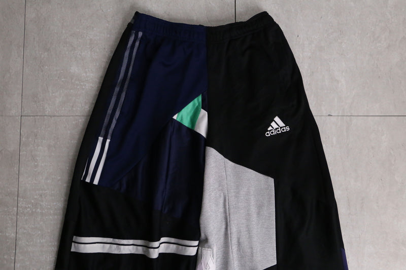 "Re:make" asymmetry docking HAKAMA track pants