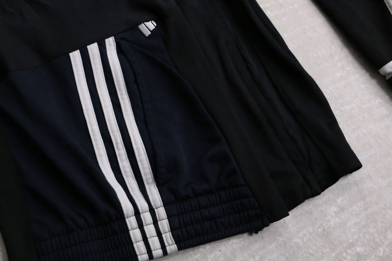 "Re:make" asymmetry docking HAKAMA track pants