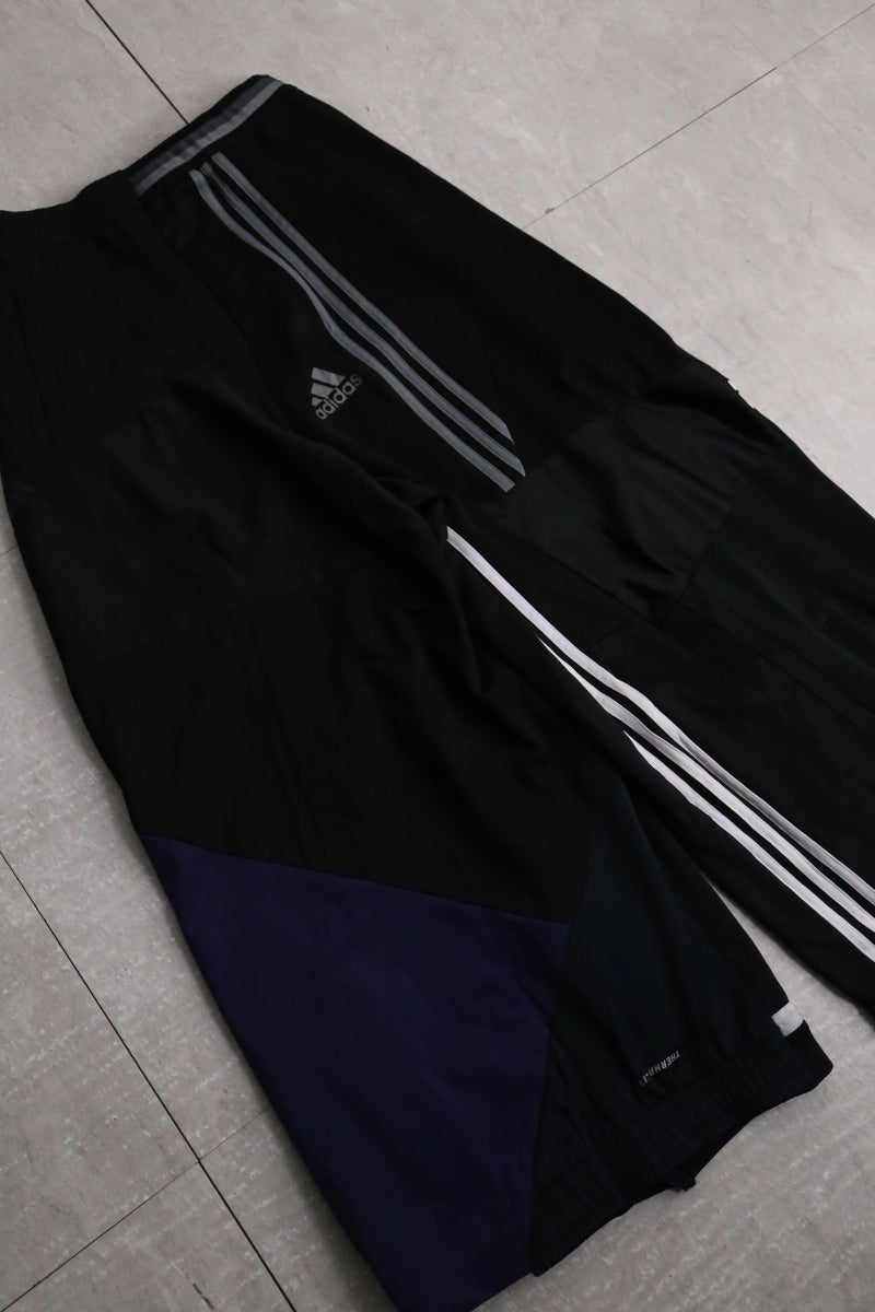 "Re:make" asymmetry docking HAKAMA track pants