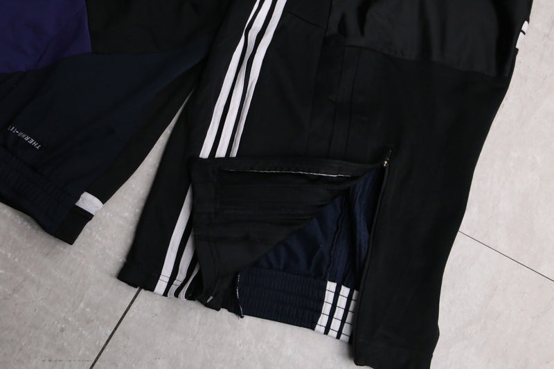 "Re:make" asymmetry docking HAKAMA track pants