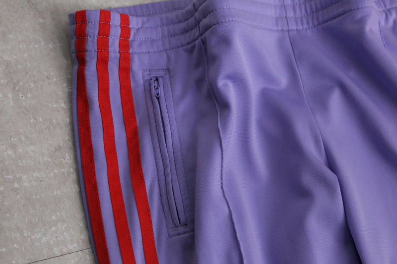 “adidas” purple × red flare track pants