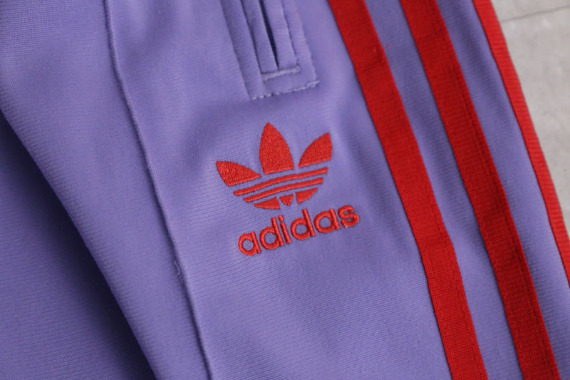 “adidas” purple × red flare track pants