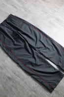 2000s NIKE side piping nylon pants