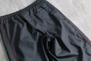 2000s NIKE side piping nylon pants