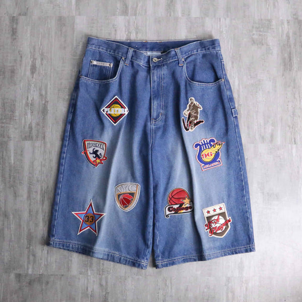 patch design over denim short pants