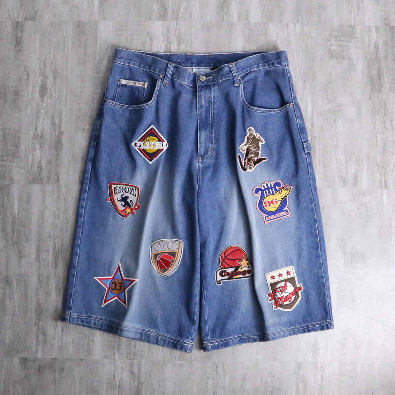 patch design over denim short pants