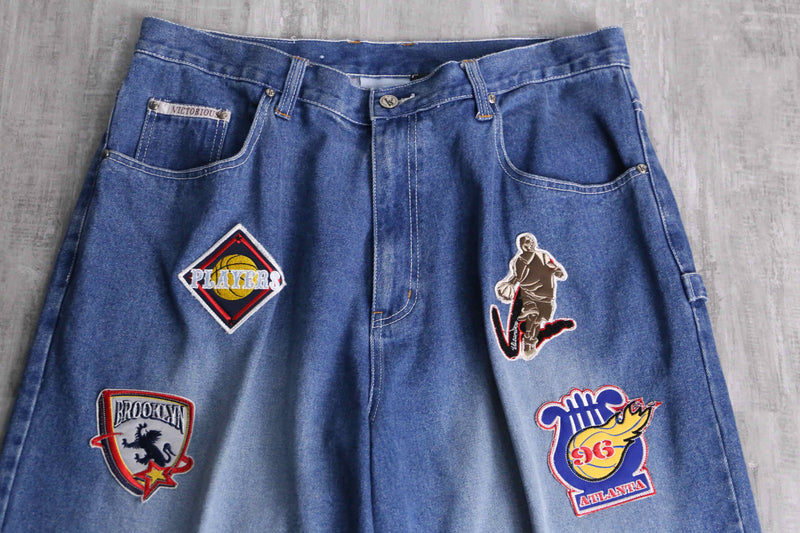 patch design over denim short pants