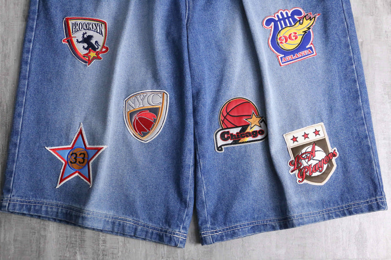 patch design over denim short pants
