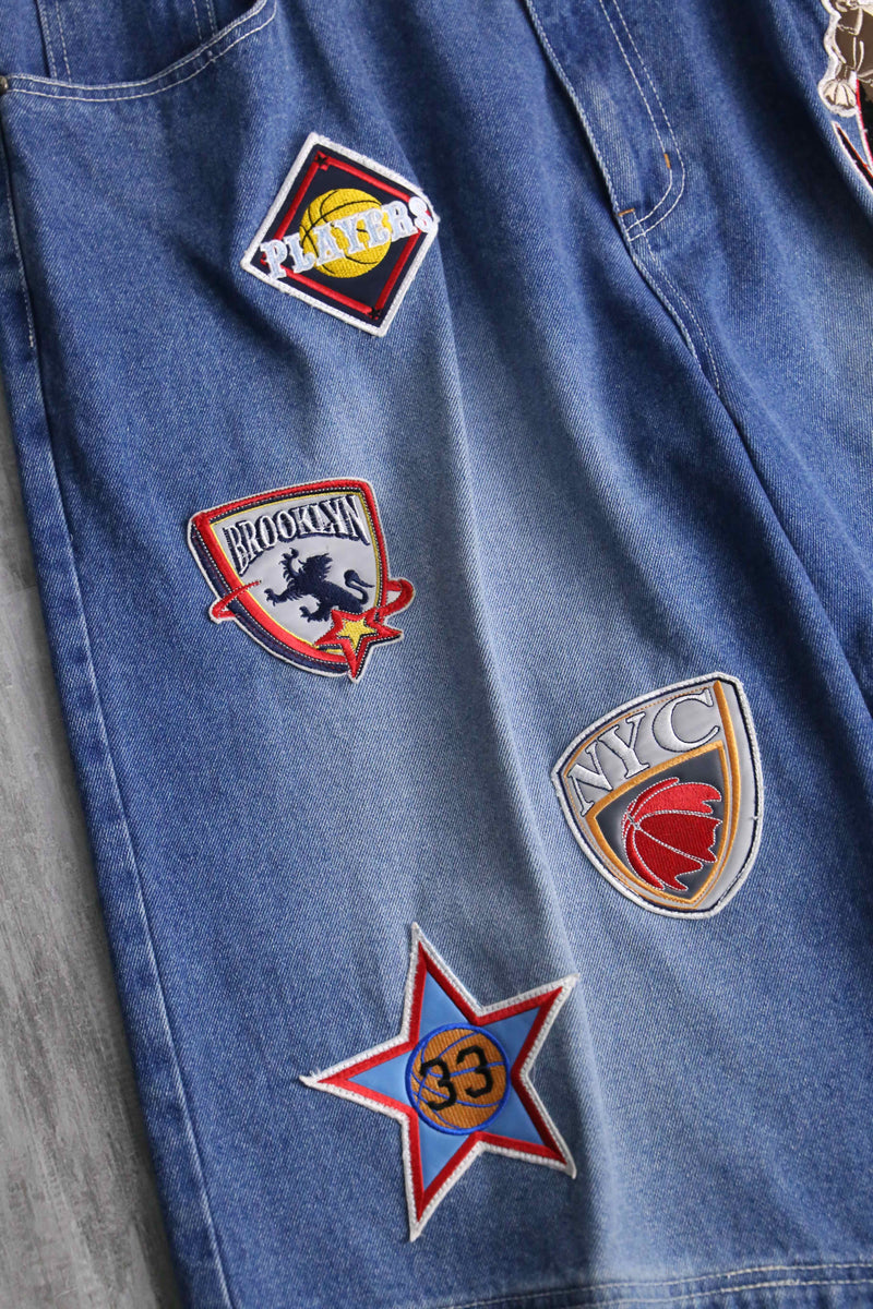patch design over denim short pants