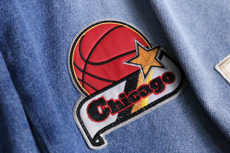patch design over denim short pants