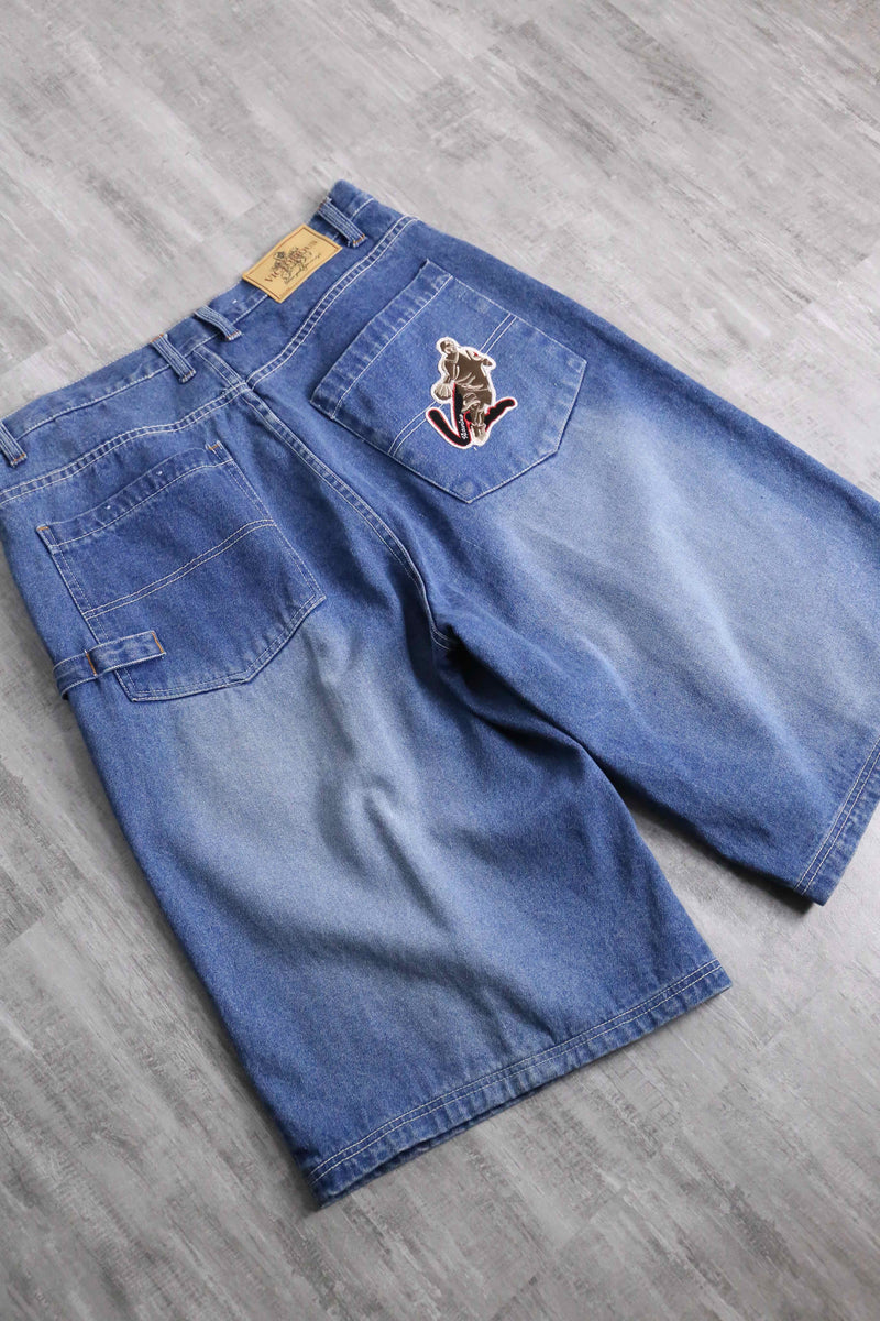 patch design over denim short pants