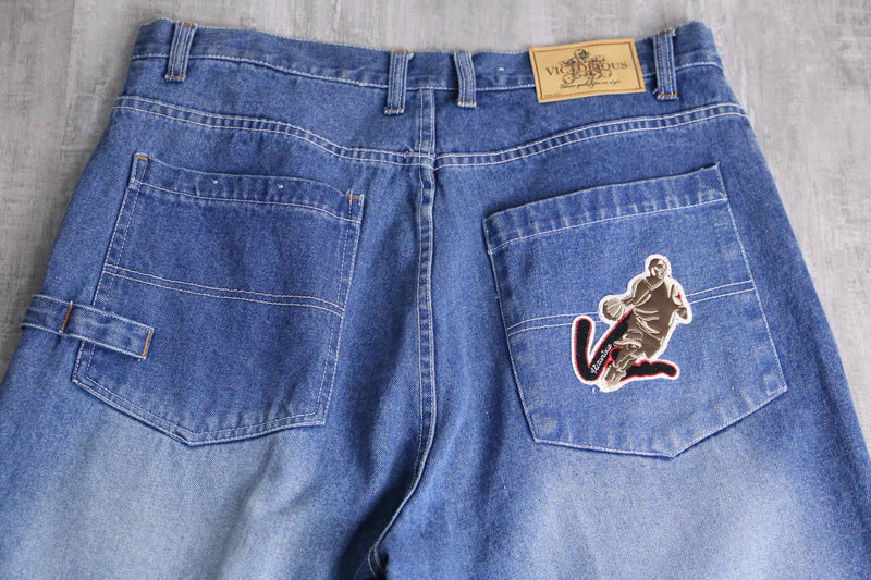 patch design over denim short pants
