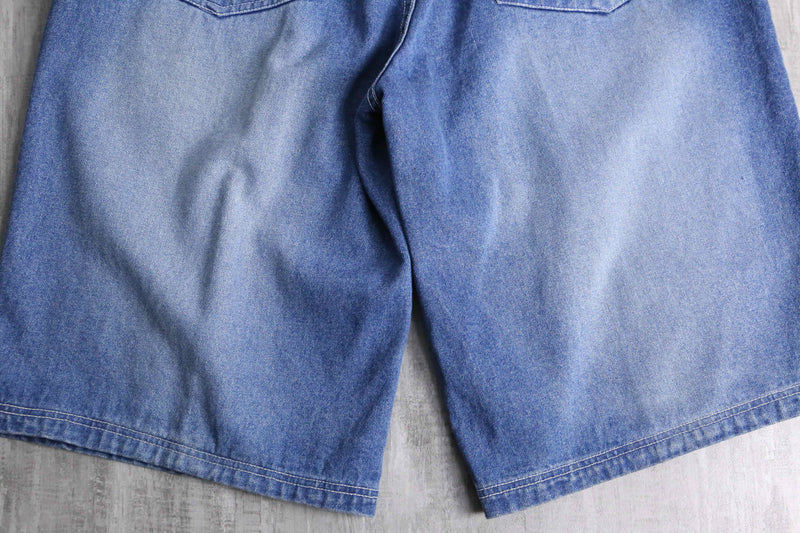 patch design over denim short pants