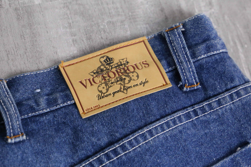 patch design over denim short pants
