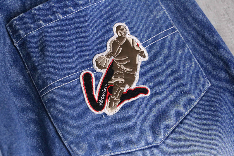 patch design over denim short pants
