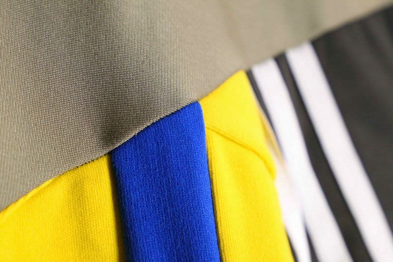 "Re:make" yellow tone random patchwork track jacket