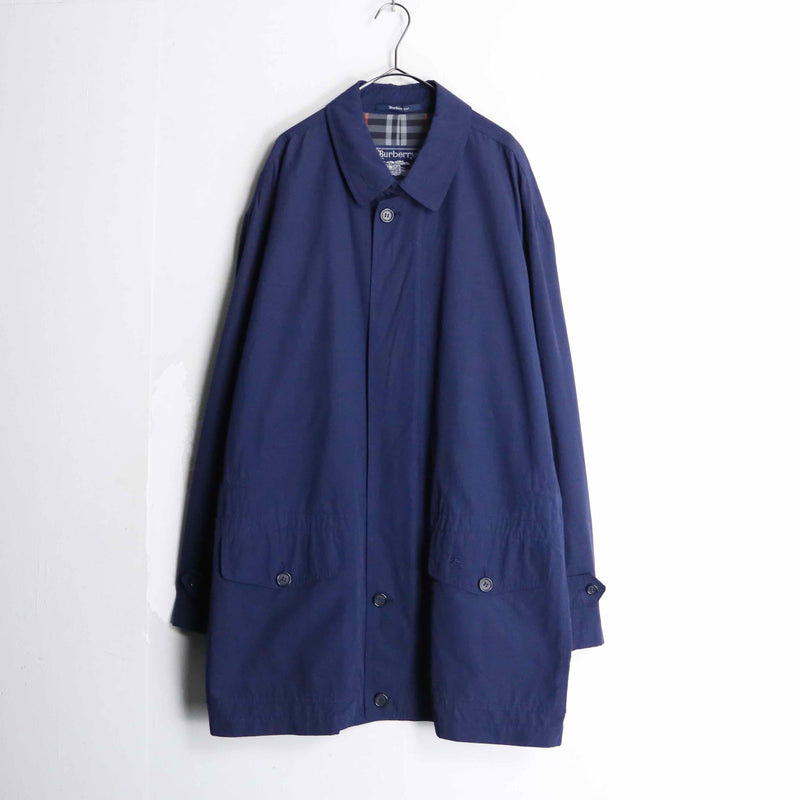 “Burberry’s” navy color front fly half coat