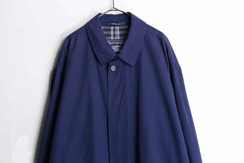 “Burberry’s” navy color front fly half coat