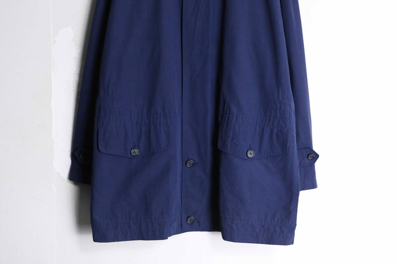 “Burberry’s” navy color front fly half coat