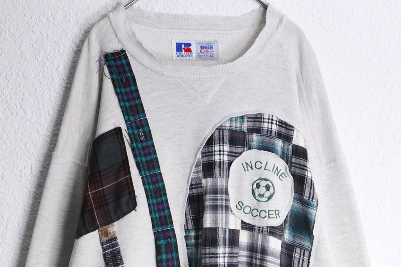 "Re:make" patchwork docking design sweat