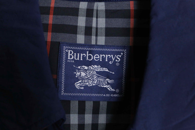 “Burberry’s” navy color front fly half coat